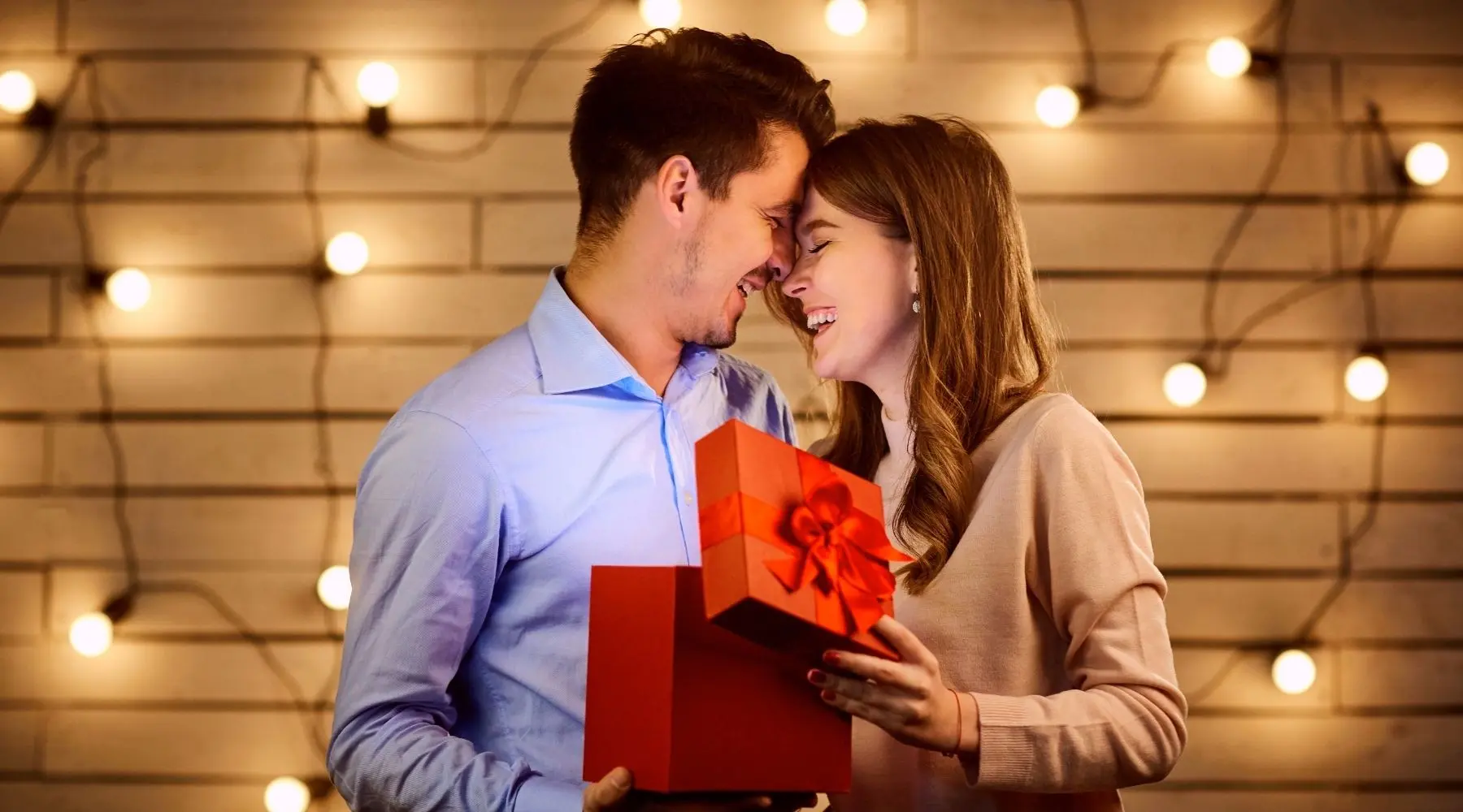 Guy giving gift to girlfriend