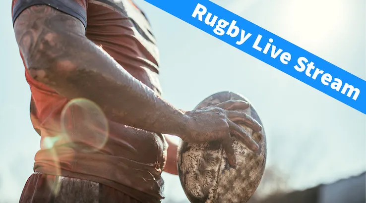 Rugby Player holding muddy ball