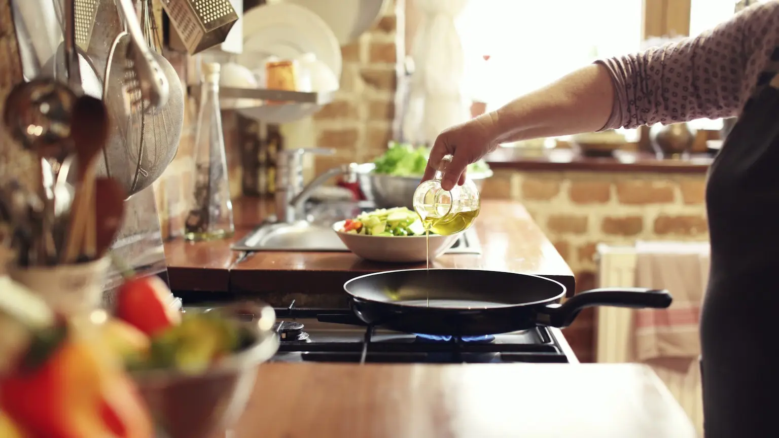 cooking vegetables in real, rustic kitchen. Natural light, short DOF, a little bit noisy.