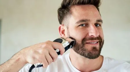 Man using a beard trimmer