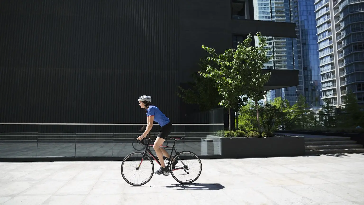 Woman riding a bicycle in an urban setting