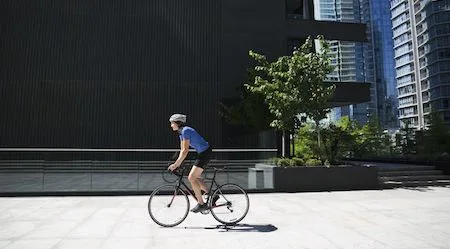 Woman riding a bicycle in an urban setting