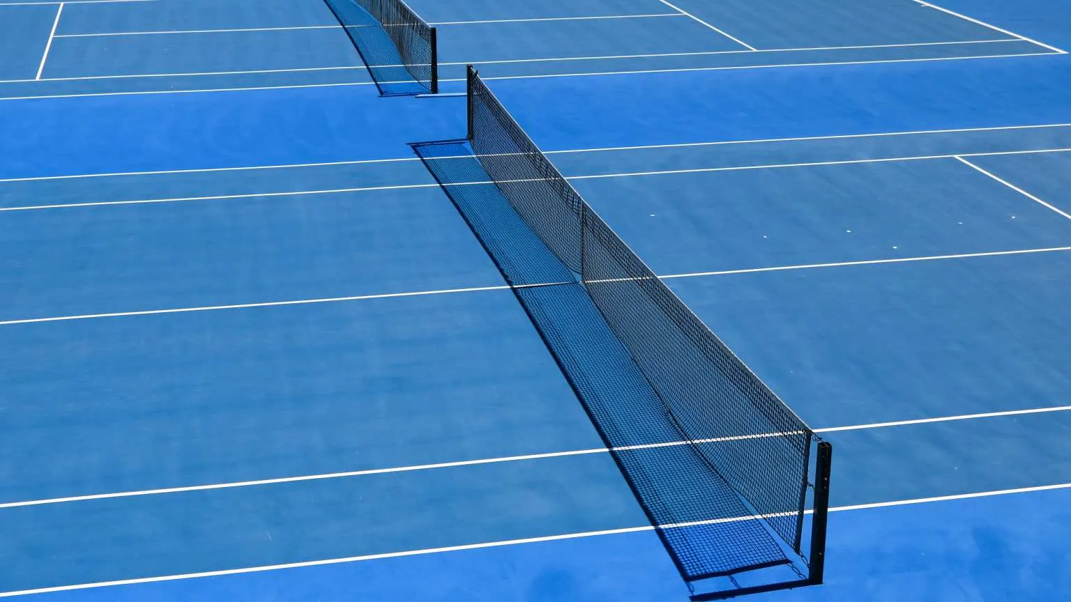 High angle view  of blue tennis court and net