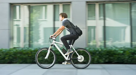 Young man riding bicycle