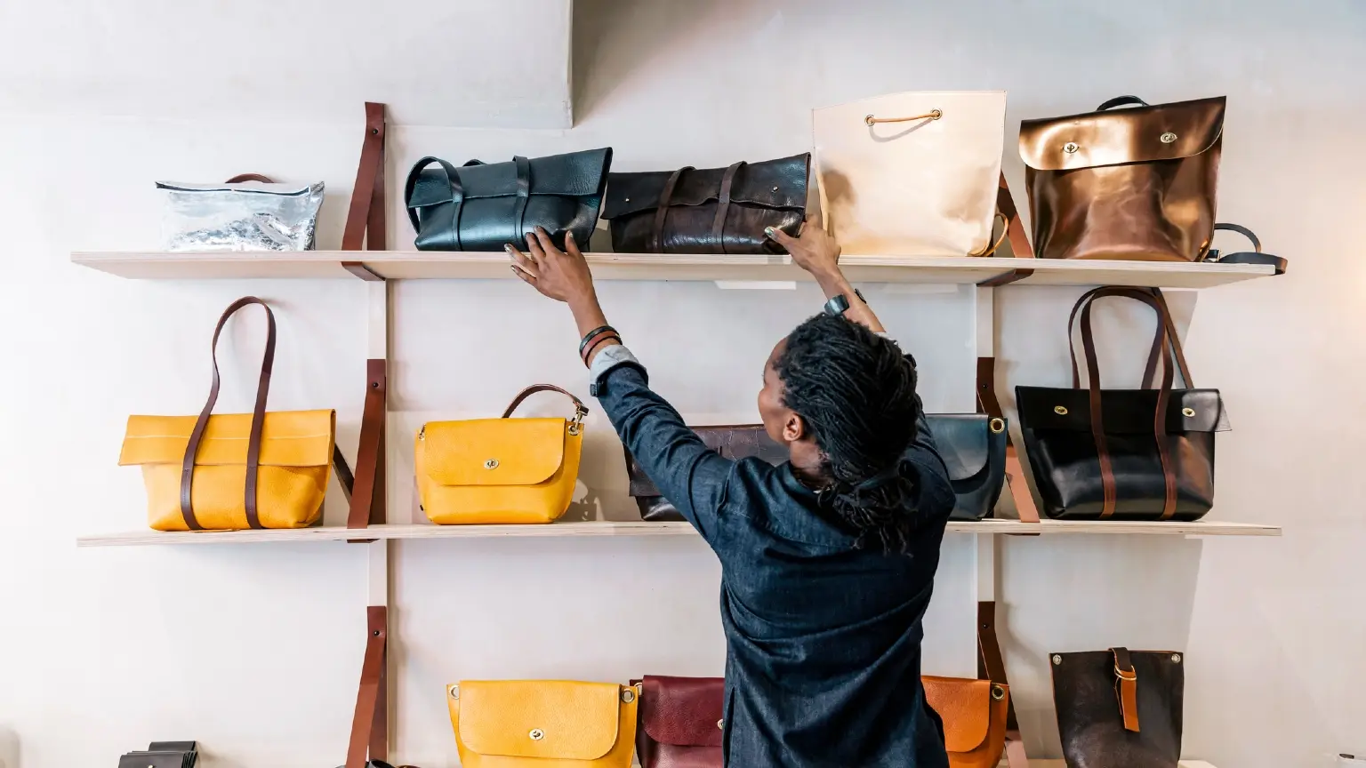 arranging handbags