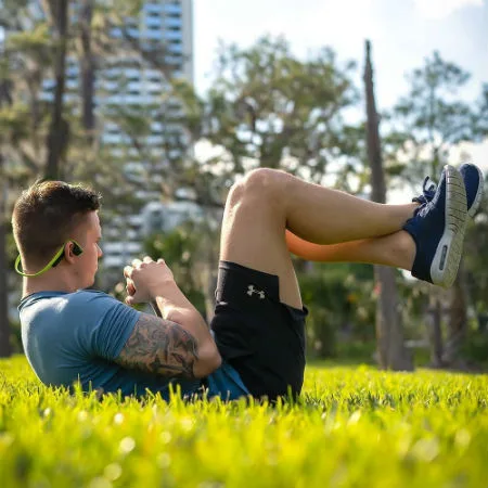 Image: Supplied Man wearing Aftershokz headphones