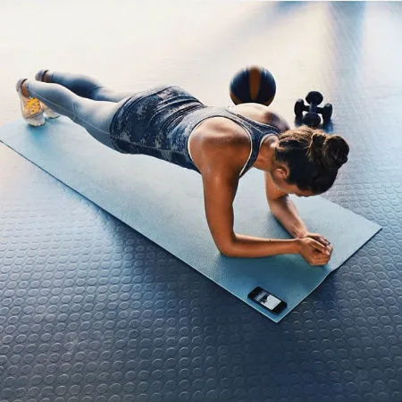 Image: Sportitude Instagram Woman stretching on yoga mat