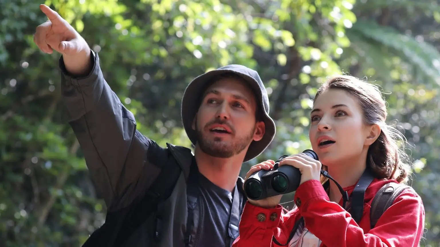 Couple using Canon binoculars 