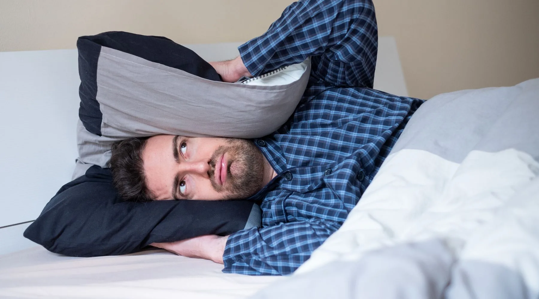 Image: Canva Trying to block out the noise before sleep