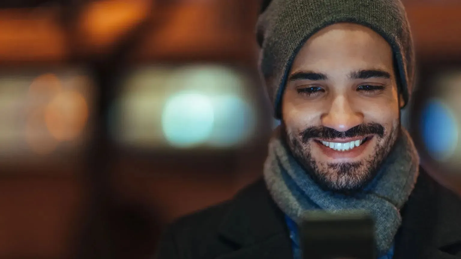 Man smiling with phone