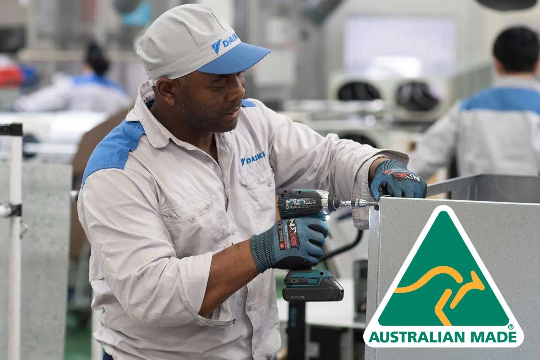 Workman manufacturing a product in a factory