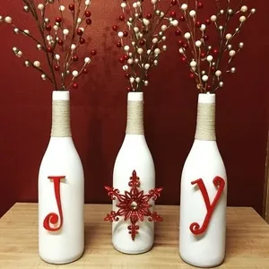 Wine bottles converted to decorative Christmas vases from Texas Uncorked on Etsy